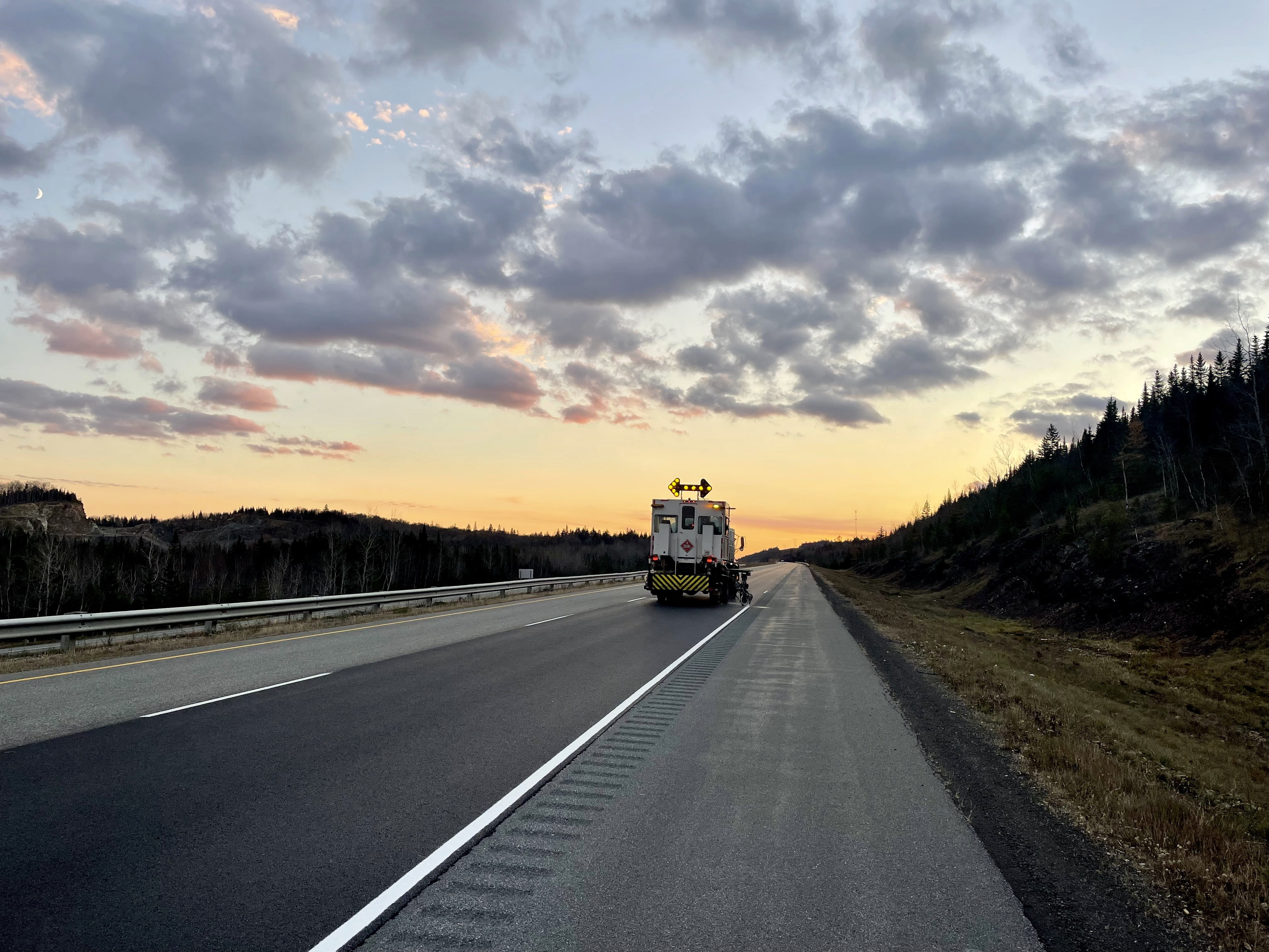 Line painting truck working on highway